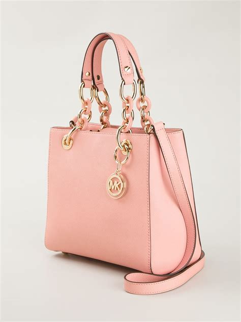 michael kors mini duffle bag purse|Michael Kors pink suitcase.